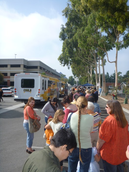 Visitors line up for the free shuttle at CSULB (where they also parked for free!) that ran back and forth between Rancho Los Alamitos for its annual Spirit of the Harvest Children's Festival.