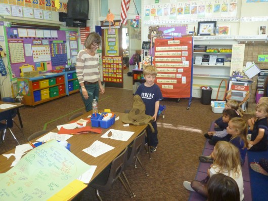 T shows his class his Sorting Hat, one of the items he brought for his Beary Important Table of Treasures.