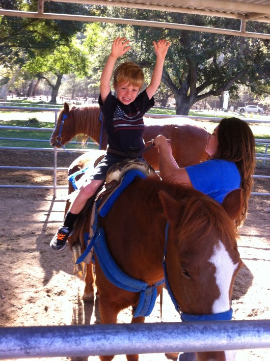 T had a blast aboard his pony at Irvine Regional Park.