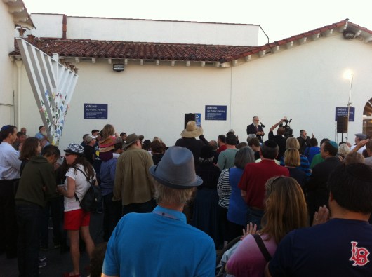 The Shul by the Shore's Rabbi Abba Perelmuter spoke to the crowd at the public Menorah lighting Sunday.
