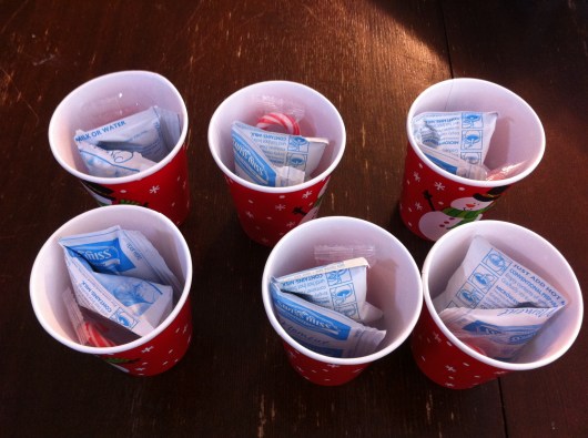 I did six cups at a time as that's how many envelopes of hot cocoa were in each box. It made it easier to work that way than open everything and have 28 cups on the table.