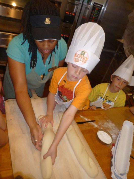 T gets to work stretching and scoring his baguette.