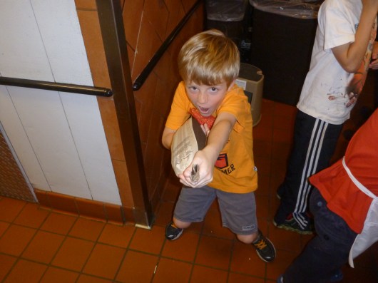 My crazy T with his baguette hot out of the oven.