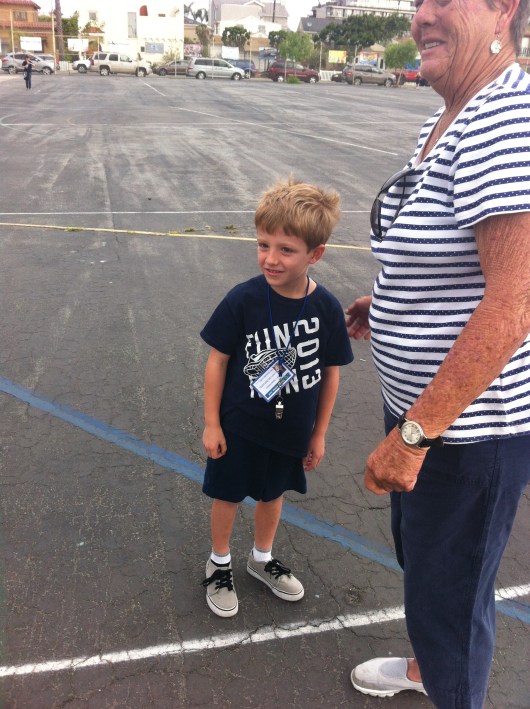 T gets his nametag and whistle before picking up duties on the playground as Coachie for the Day at school.