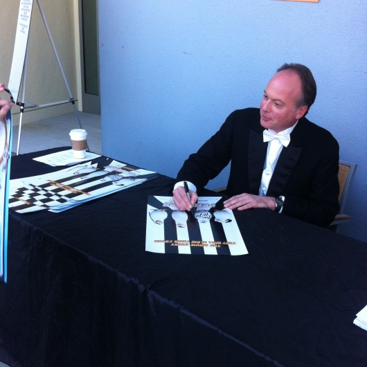 McGrath signed movie posters for attendees at the Aquarium of the Pacific's Penguins of Madagascar cross-promotional event Wednesday November 5, 2014.
