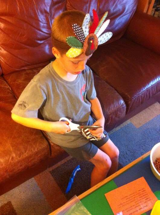 T is now 7 years old and quite capable with the "real scissors." Please always use your own discretion as to whether your child is ready for this step.