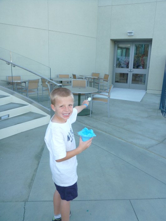 T asks, "NOW Can we go to the gift shop?!" Man, I don't think I've ever captured such a joyous look on this kid's face in all his life. Must be the free shave ice (and gift shop).