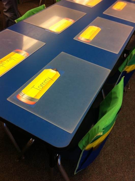 T's desk. He's right by the door for a quick getaway.